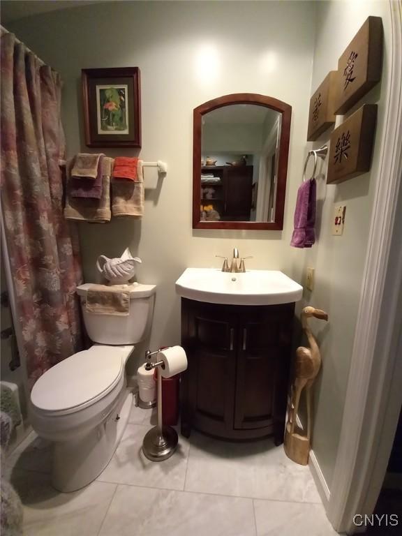 8054 Fargo Rd, Henderson, NY 13650 - full bathroom with tile patterned flooring, vanity, toilet, and a shower with shower curtain