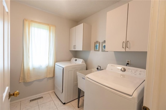 401 Montvale Ln, Greece, NY 14626 - laundry area featuring washer and clothes dryer, cabinet space, and baseboards