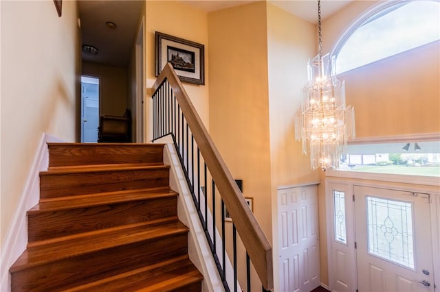 401 Montvale Ln, Greece, NY 14626 - entryway featuring a chandelier and stairway