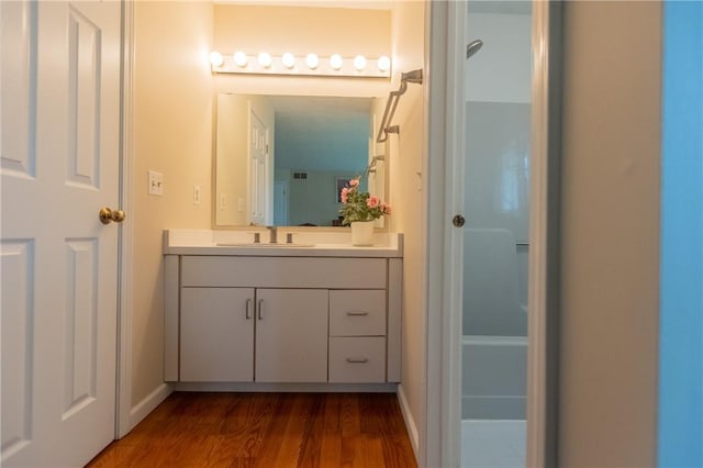 401 Montvale Ln, Greece, NY 14626 - bathroom featuring wood finished floors, vanity, and baseboards