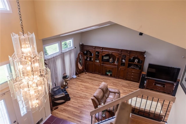 401 Montvale Ln, Greece, NY 14626 - living area with a chandelier, wood finished floors, and a high ceiling