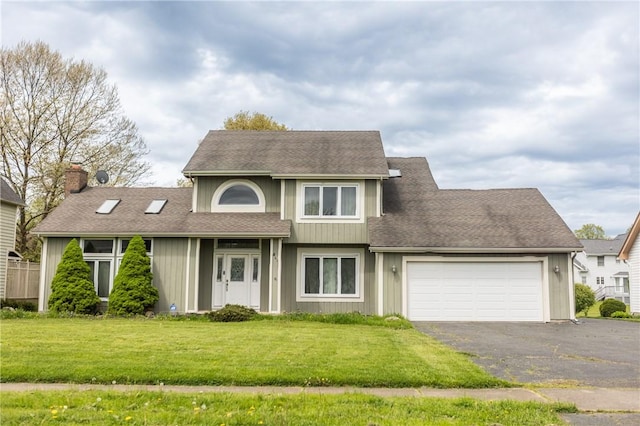 401 Montvale Ln, Greece, NY 14626 - view of front of house featuring an attached garage, asphalt driveway, a chimney, a front lawn, and roof with shingles