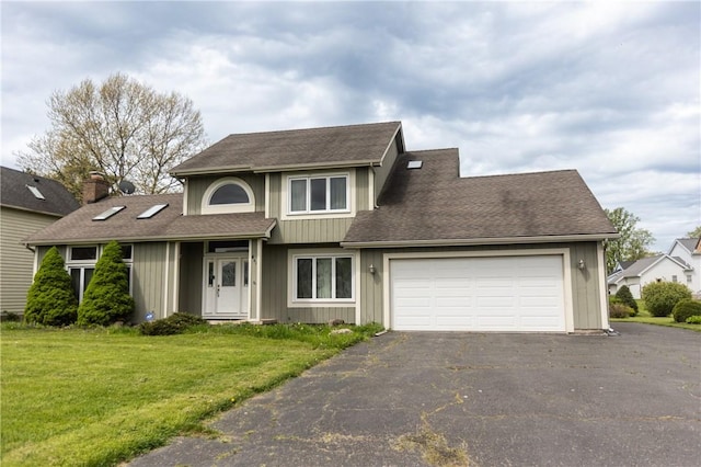 401 Montvale Ln, Greece, NY 14626 - traditional-style house featuring driveway, an attached garage, a front yard, and a shingled roof