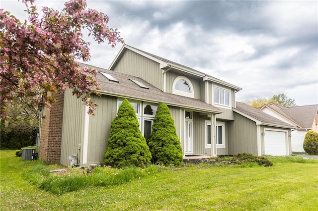 401 Montvale Ln, Greece, NY 14626 - view of front of house with a garage, central AC, a front lawn, and a shingled roof
