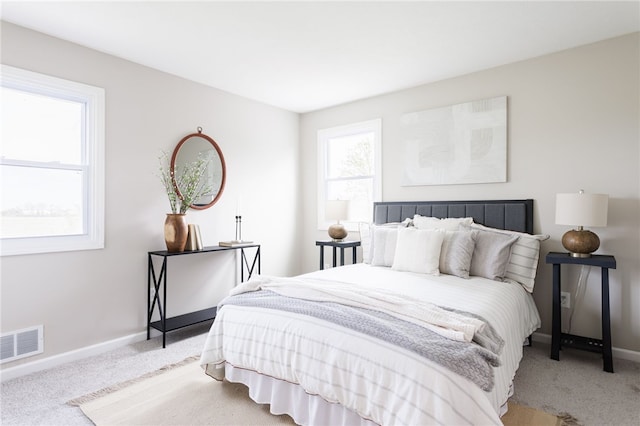 bedroom with carpet flooring and baseboards
