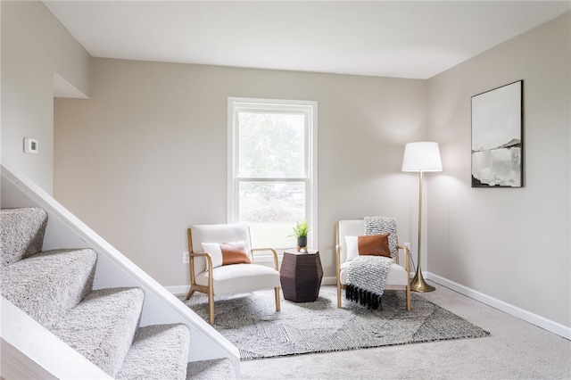 sitting room with stairway, carpet, and baseboards