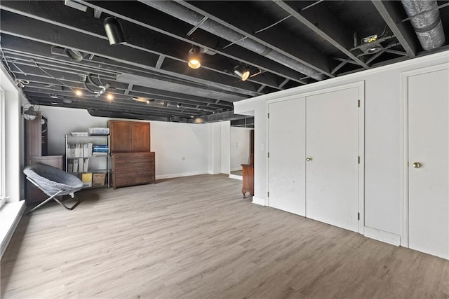 finished basement featuring wood finished floors