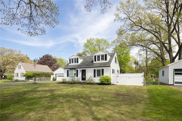 cape cod-style house with a gate
