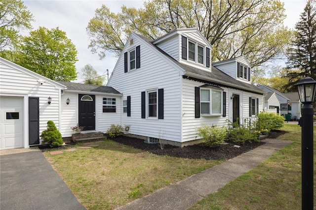 new england style home with a front yard and roof with shingles