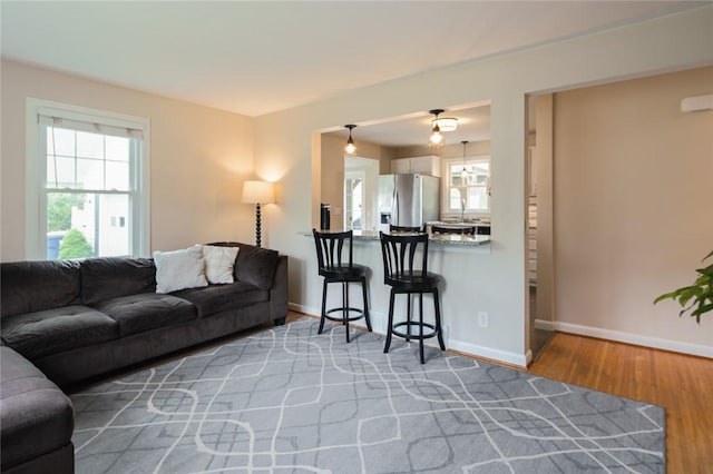 living area featuring wood finished floors and baseboards