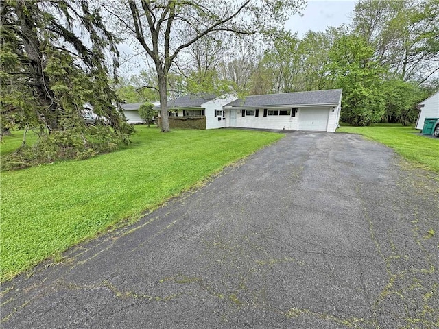 388 Hemingway Dr, Brighton, NY 14620 - view of front of house with driveway, a garage, and a front yard