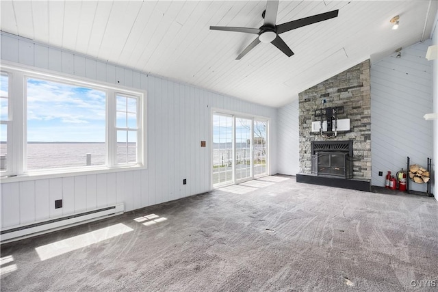 1019 State Route 49, Constantia, NY 13028 - unfurnished living room featuring baseboard heating, ceiling fan, a stone fireplace, carpet, and vaulted ceiling