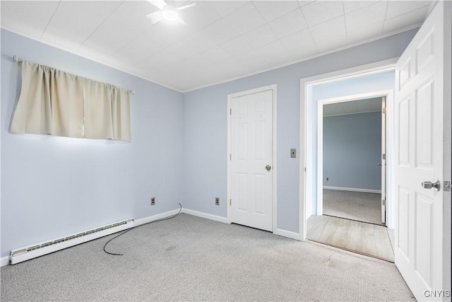 1019 State Route 49, Constantia, NY 13028 - unfurnished bedroom featuring baseboard heating, carpet, and baseboards