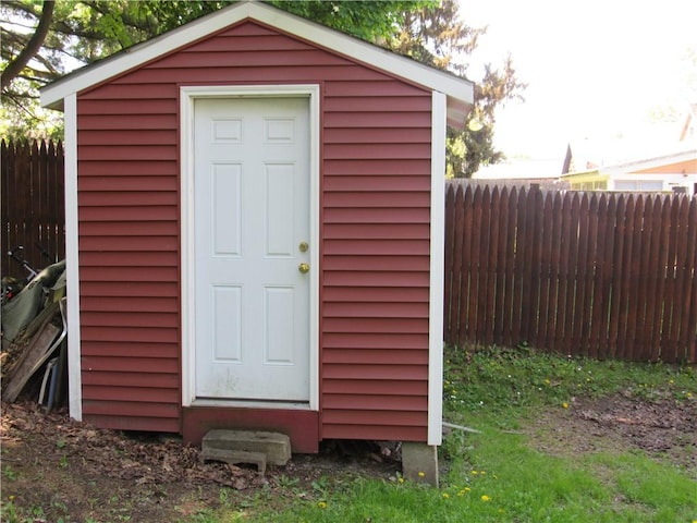 view of shed with fence