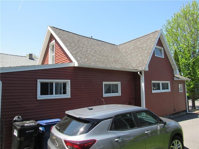 view of home's exterior featuring a shingled roof