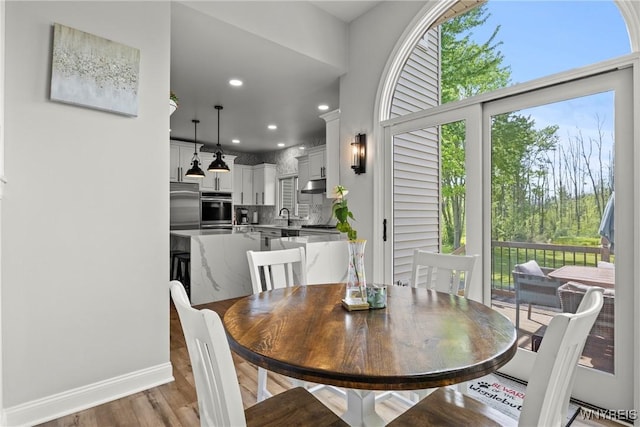 3750 Transit Rd, Orchard Park, NY 14127 - dining room featuring light wood-style flooring, recessed lighting, and baseboards