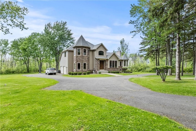 3750 Transit Rd, Orchard Park, NY 14127 - view of front facade with a front yard, stone siding, a chimney, and asphalt driveway