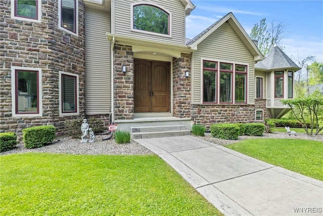 3750 Transit Rd, Orchard Park, NY 14127 - entrance to property featuring stone siding and a lawn