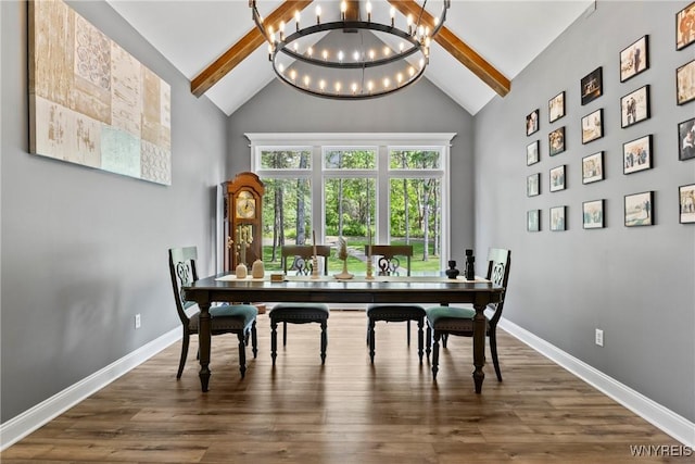 3750 Transit Rd, Orchard Park, NY 14127 - dining space with beam ceiling, high vaulted ceiling, a chandelier, dark wood-style floors, and baseboards