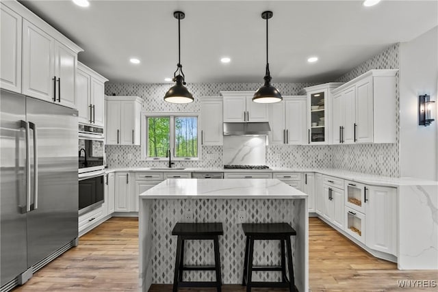 3750 Transit Rd, Orchard Park, NY 14127 - kitchen with stainless steel appliances, a sink, white cabinetry, and recessed lighting