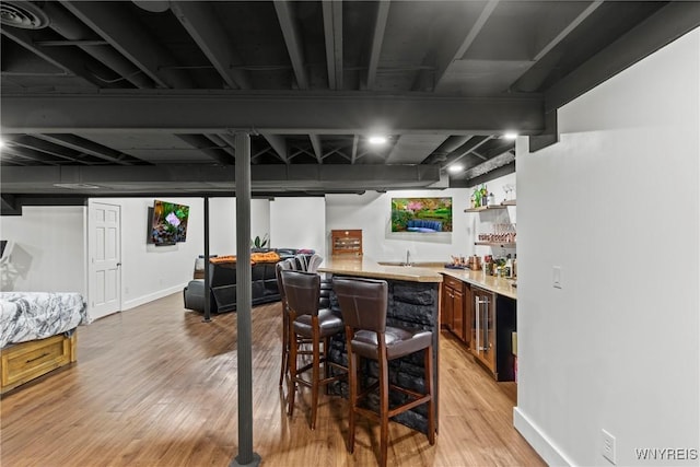 3750 Transit Rd, Orchard Park, NY 14127 - indoor wet bar with light wood-style flooring, beverage cooler, and baseboards