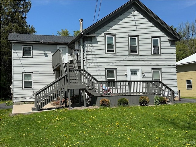 24 W Main St, Eaton, NY 13408 - back of house with stairway, a lawn, and a deck