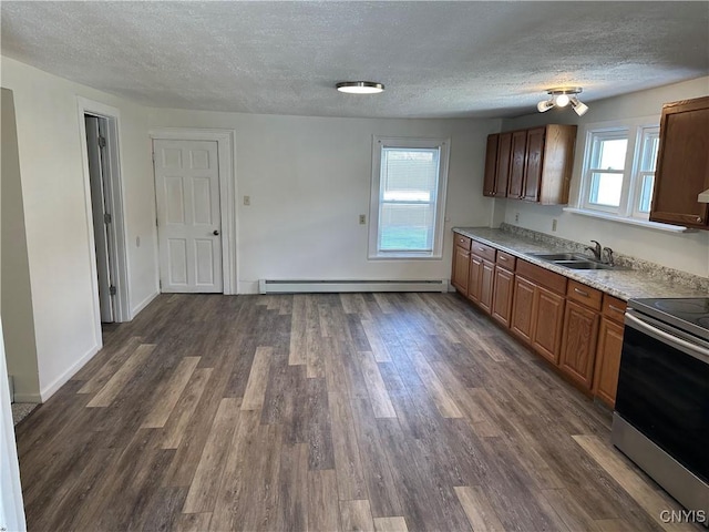 24 W Main St, Eaton, NY 13408 - kitchen with baseboard heating, stainless steel electric range oven, a sink, a textured ceiling, and plenty of natural light