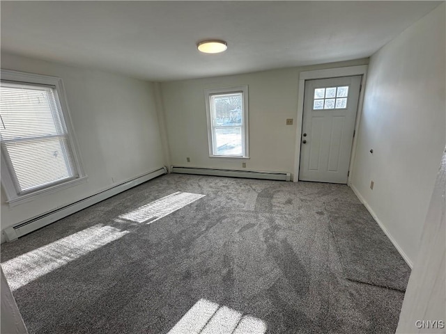 24 W Main St, Eaton, NY 13408 - carpeted foyer with a baseboard heating unit, healthy amount of natural light, and baseboards