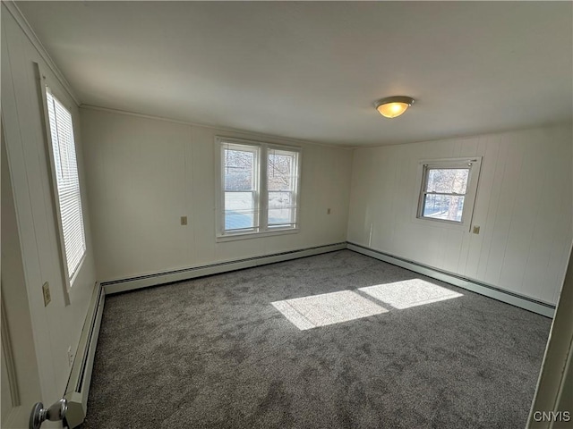 24 W Main St, Eaton, NY 13408 - spare room with carpet floors and a baseboard radiator