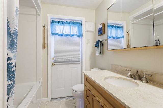 full bathroom featuring toilet, tile patterned flooring, vanity, and shower / tub combo with curtain
