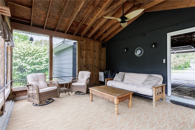 sunroom with a ceiling fan, healthy amount of natural light, and vaulted ceiling