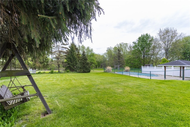view of yard with view of wooded area