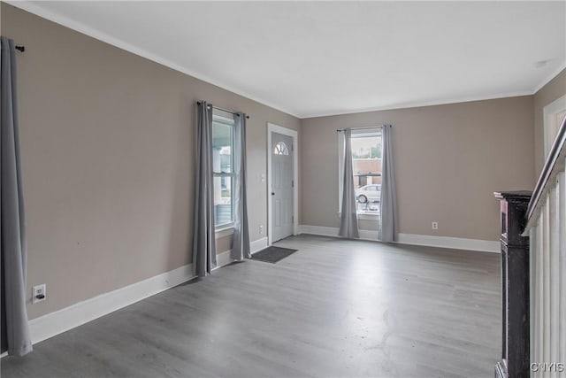 121 Roney Rd, Syracuse, NY 13205 - foyer entrance featuring ornamental molding, wood finished floors, and baseboards