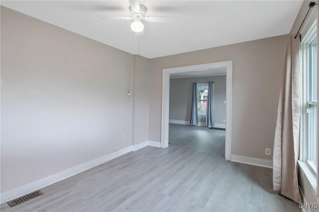 121 Roney Rd, Syracuse, NY 13205 - spare room with a ceiling fan, light wood-style floors, and baseboards