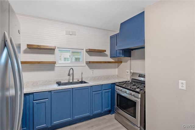 121 Roney Rd, Syracuse, NY 13205 - kitchen with stainless steel appliances, open shelves, a sink, blue cabinetry, and light wood-type flooring