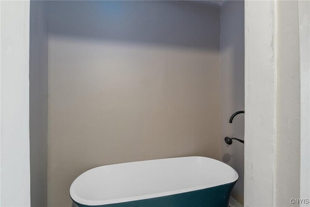 121 Roney Rd, Syracuse, NY 13205 - bathroom featuring a freestanding tub