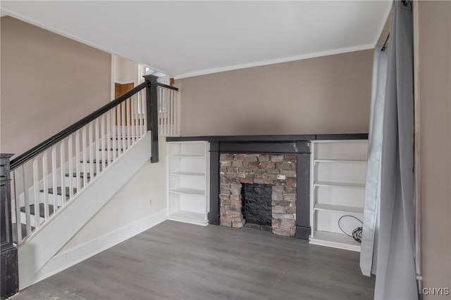 121 Roney Rd, Syracuse, NY 13205 - unfurnished living room featuring wood finished floors, baseboards, crown molding, built in shelves, and stairs