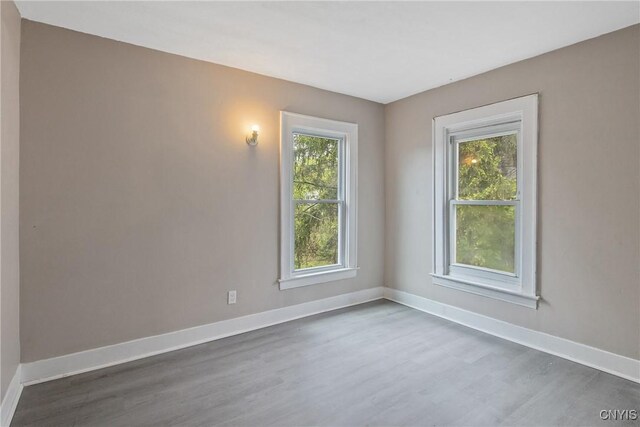 121 Roney Rd, Syracuse, NY 13205 - unfurnished room featuring wood finished floors and baseboards