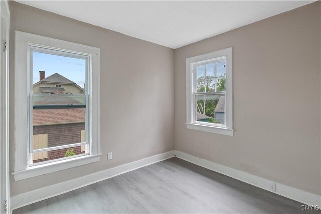 121 Roney Rd, Syracuse, NY 13205 - unfurnished room featuring wood finished floors and baseboards