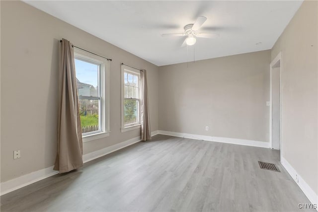 121 Roney Rd, Syracuse, NY 13205 - empty room with light wood-style flooring, ceiling fan, and baseboards