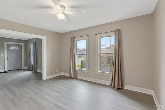121 Roney Rd, Syracuse, NY 13205 - empty room with light wood-style floors, baseboards, and a ceiling fan