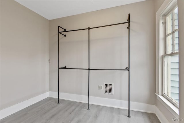 121 Roney Rd, Syracuse, NY 13205 - unfurnished bedroom featuring wood finished floors and baseboards