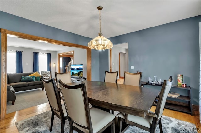 3472 Stevenson Ct, Wheatfield, NY 14120 - dining room featuring a chandelier and light wood finished floors