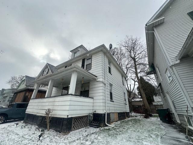 199 Roycroft Dr, Rochester, NY 14621 - view of snowy exterior with covered porch