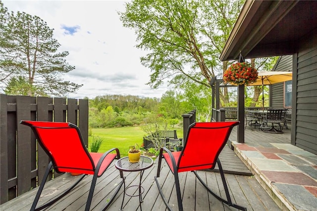 wooden deck featuring outdoor dining space