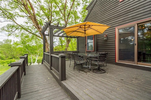 wooden terrace with outdoor dining area