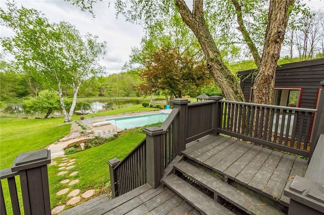 deck featuring a water view and a yard