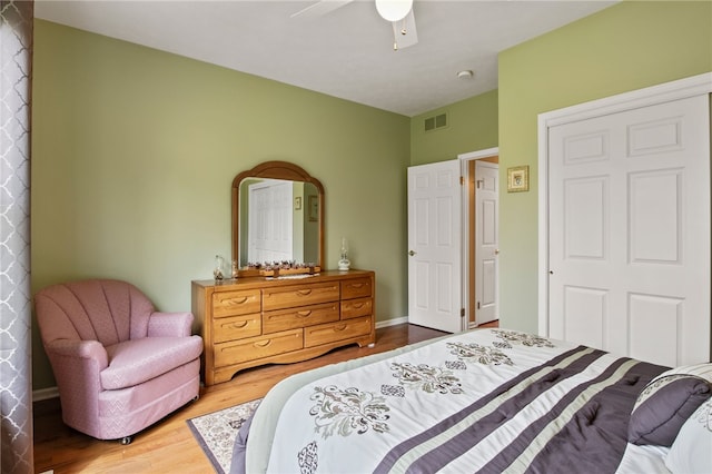 bedroom with wood finished floors and a ceiling fan