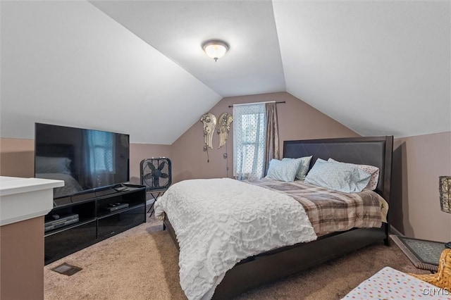 bedroom featuring carpet flooring and lofted ceiling