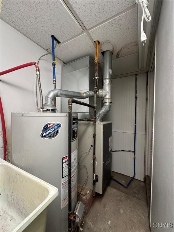 utilities featuring water heater and a sink